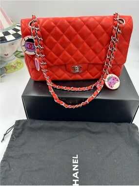 Chanel Quilted MATELASSE Classic Flap Bag in Red with Silver Chain AND CHARMS .
